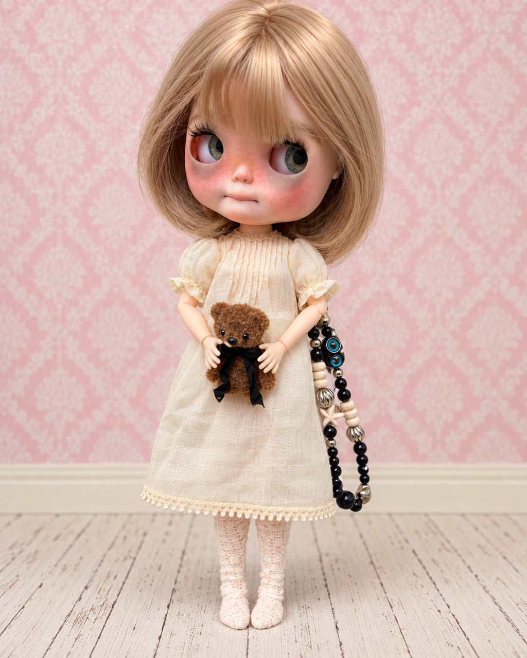 AI-edited presentation image of Nell in a pink miniature studio. Based on real product references; scene furniture and props are not included.