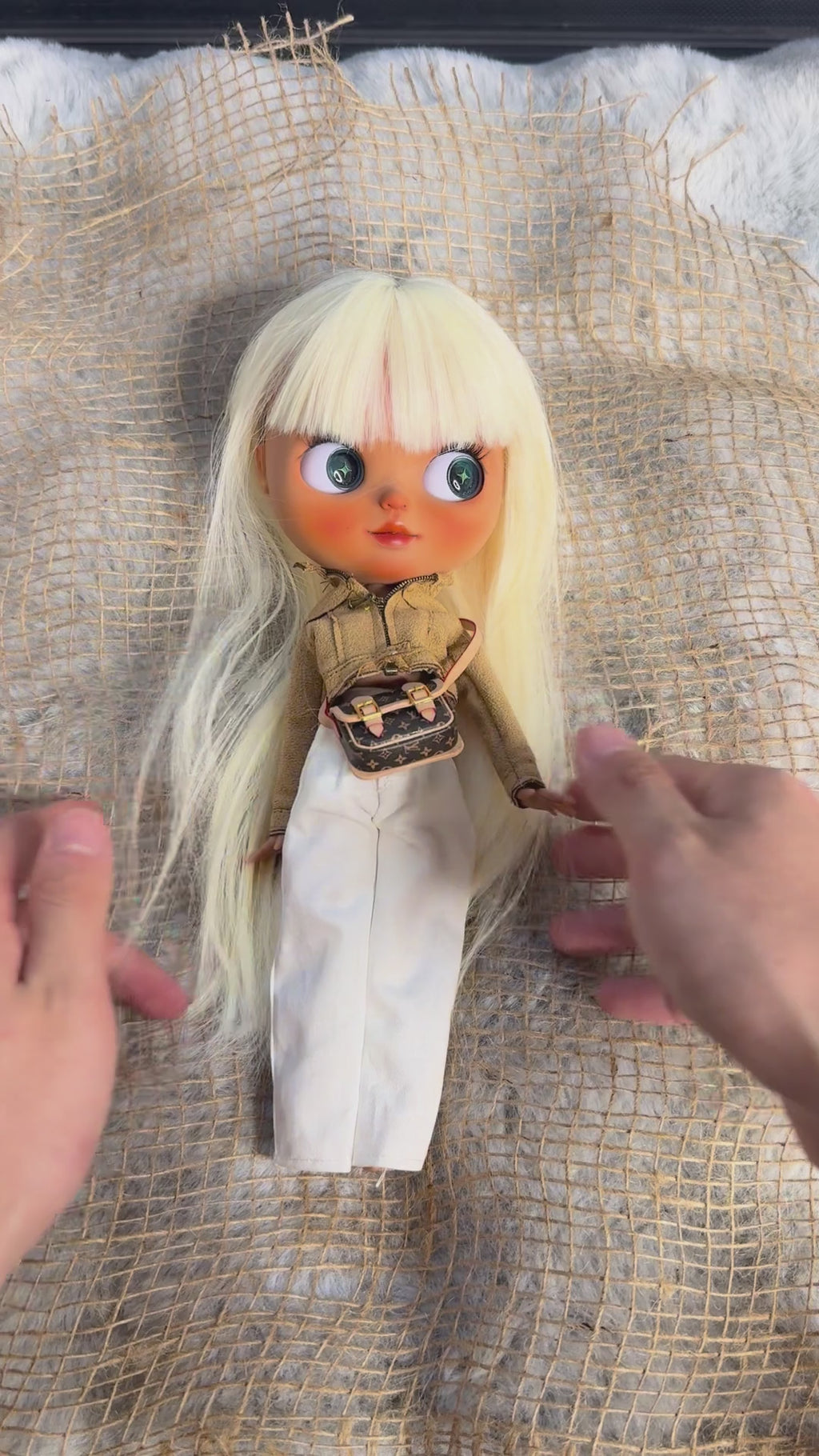 Real product demonstration video of Marlowe, showing the physical doll, outfit and eye mechanism.