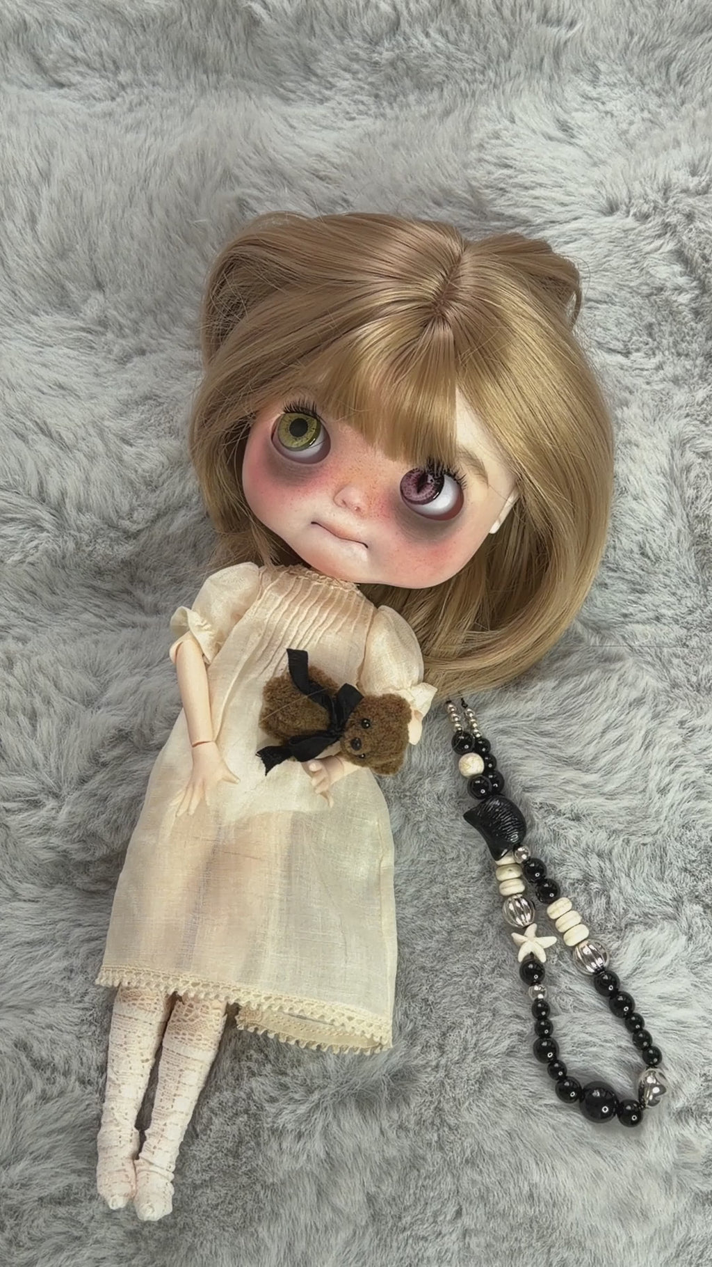 Real product demonstration video of Nell, showing the physical doll, outfit and eye mechanism.